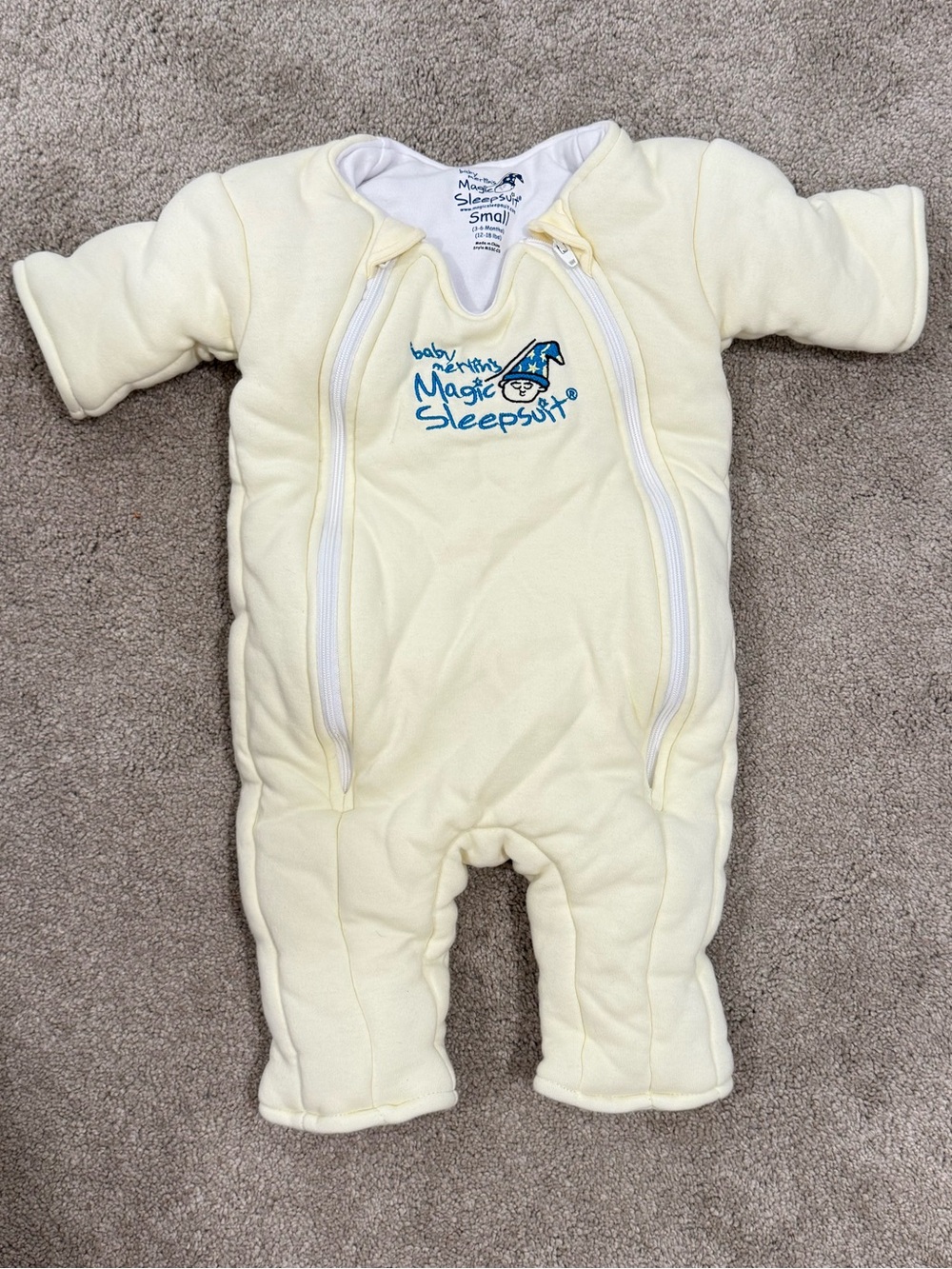 Baby Merlin’s magic sleep suit pale yellow like new